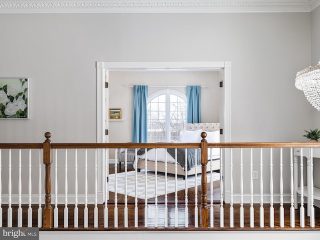 interior space with crown molding and an inviting chandelier