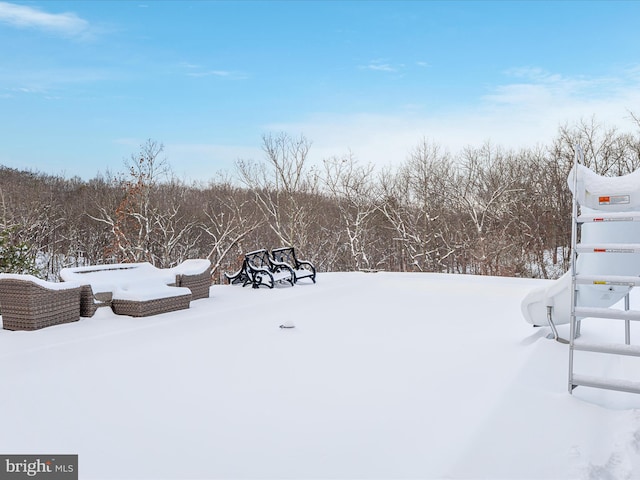 view of yard layered in snow