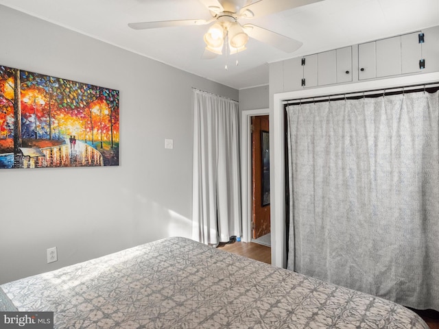 bedroom featuring hardwood / wood-style flooring and ceiling fan