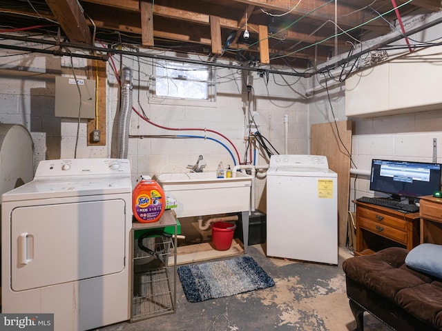 clothes washing area with sink and washing machine and clothes dryer