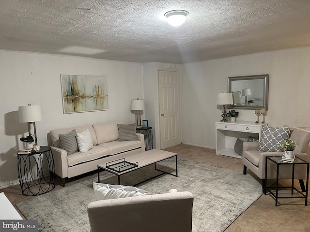 carpeted living room featuring a textured ceiling