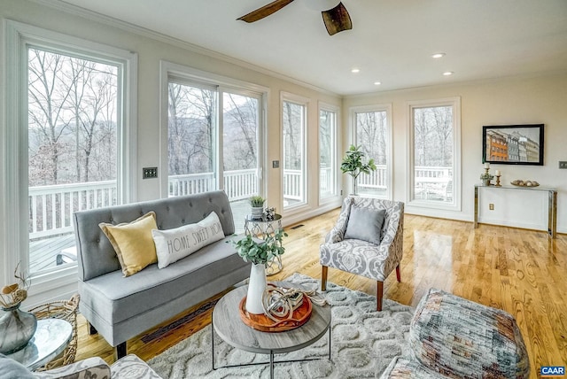 sunroom / solarium with ceiling fan