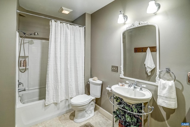 full bathroom with sink, shower / bathtub combination with curtain, and toilet