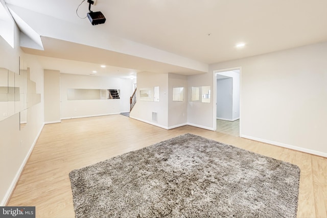 unfurnished living room featuring light wood-type flooring