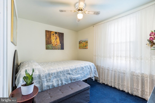 bedroom featuring ceiling fan and carpet floors