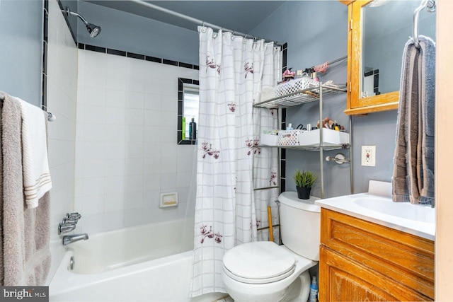 full bathroom with shower / tub combo, vanity, and toilet