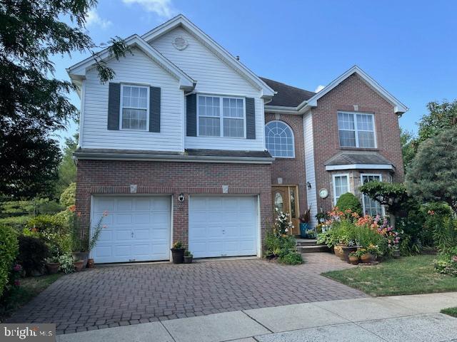 front facade with a garage