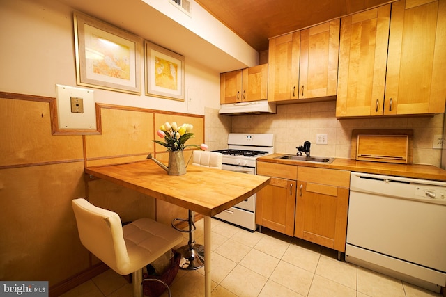 kitchen with sink, tasteful backsplash, wooden counters, white appliances, and light tile patterned flooring