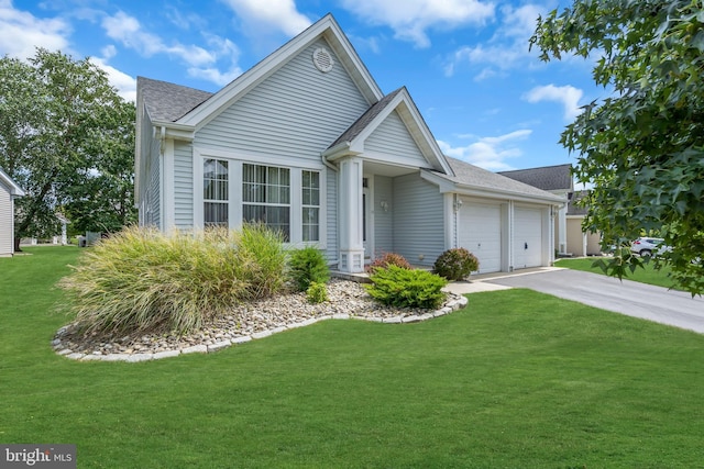 view of front of property featuring a garage and a front lawn