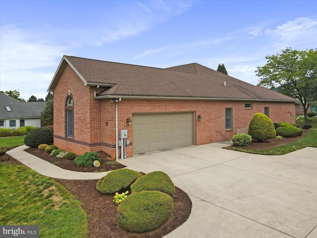 view of side of home featuring a garage