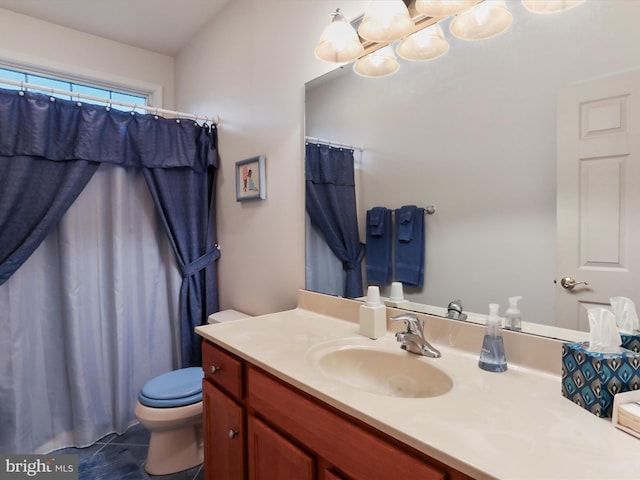 bathroom with toilet and vanity