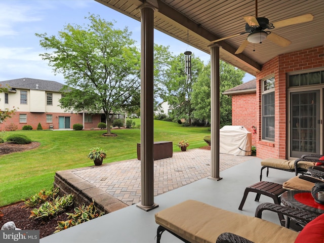 view of patio / terrace with ceiling fan and a grill