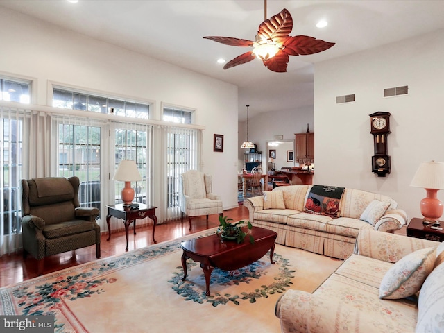 living room featuring ceiling fan and wood-type flooring