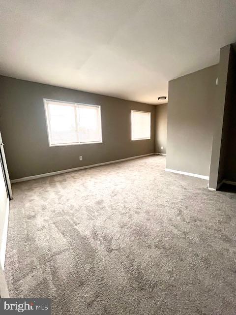 unfurnished room featuring carpet flooring