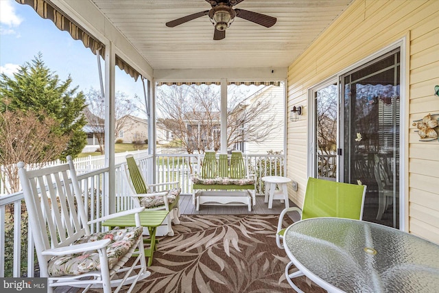 exterior space with ceiling fan