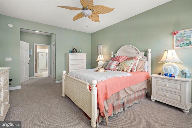 bedroom with light carpet, ensuite bathroom, and ceiling fan