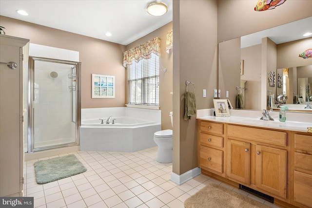 full bathroom featuring tile patterned floors, vanity, toilet, and shower with separate bathtub