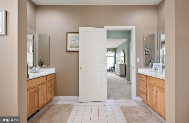 bathroom with tile patterned flooring and vanity