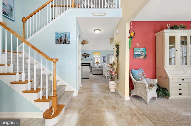 entrance foyer featuring light carpet