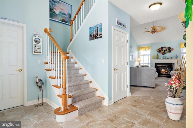 staircase with lofted ceiling