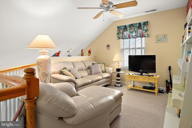 carpeted living room with ceiling fan and lofted ceiling