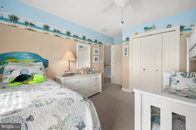 carpeted bedroom featuring ceiling fan and a closet