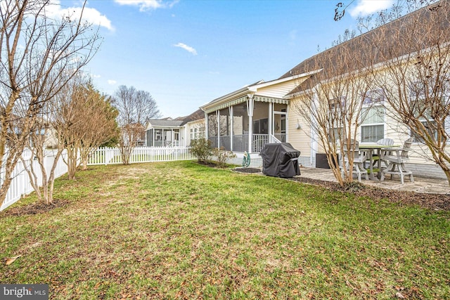 view of yard featuring a sunroom and a patio