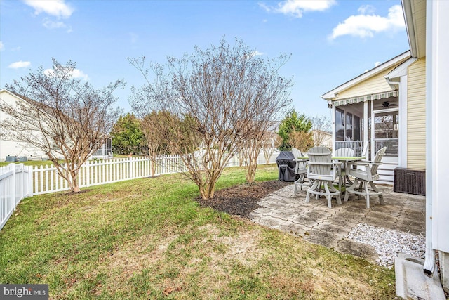 view of yard with a patio and a sunroom