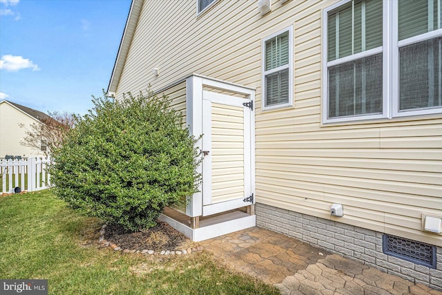 view of home's exterior with a lawn