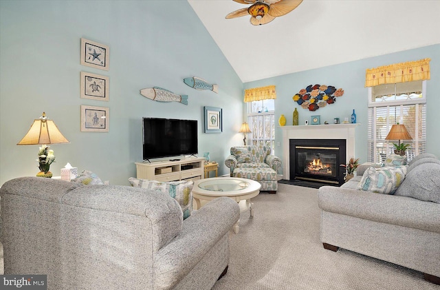 living room featuring carpet, ceiling fan, a healthy amount of sunlight, and high vaulted ceiling