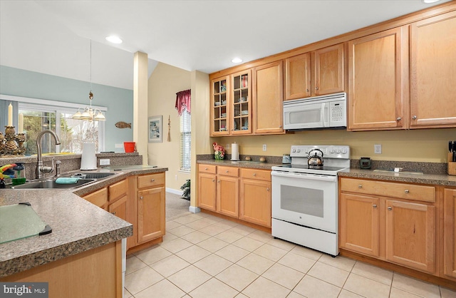 kitchen with sink, an inviting chandelier, decorative light fixtures, white appliances, and light tile patterned floors