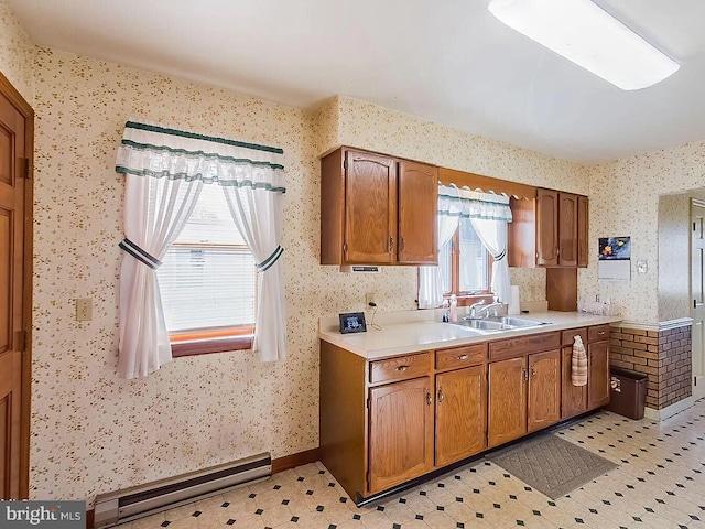 kitchen with sink and a baseboard heating unit