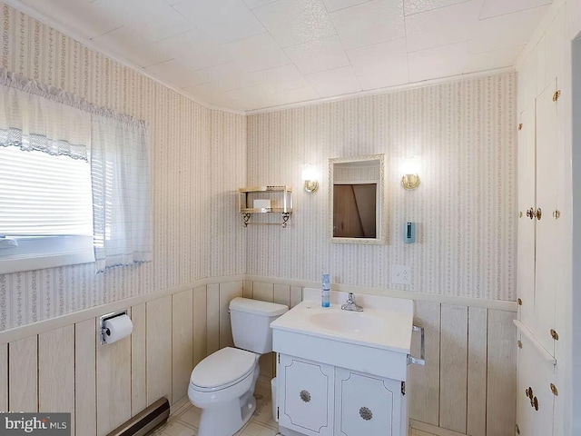 bathroom with vanity, ornamental molding, and toilet