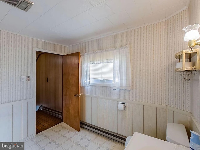 bathroom with toilet and crown molding