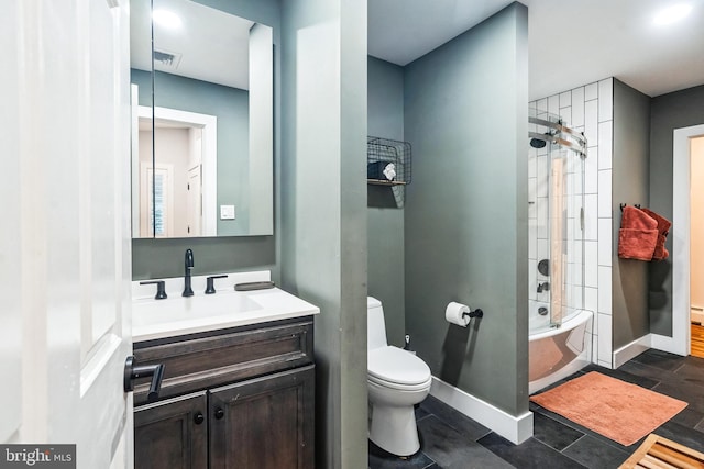 full bathroom featuring vanity, toilet, and tiled shower / bath