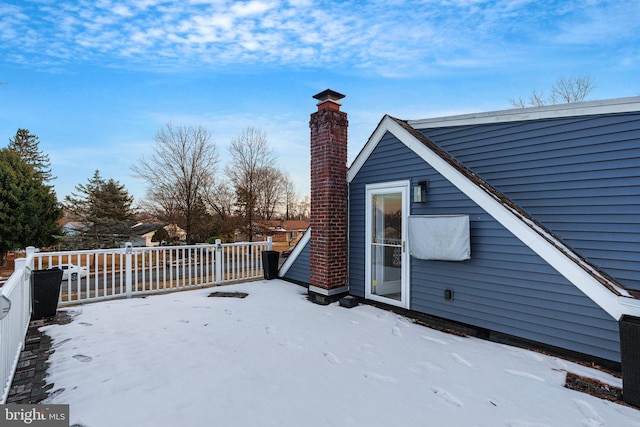 view of snow covered deck