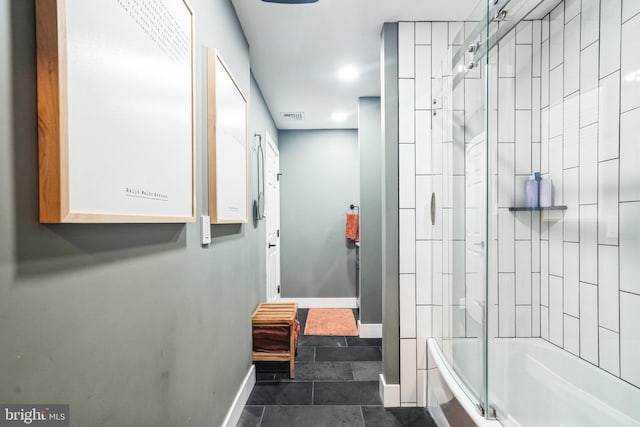 bathroom with tile patterned flooring and enclosed tub / shower combo