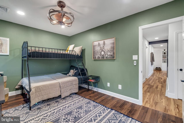 bedroom with hardwood / wood-style flooring