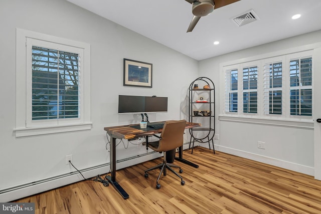 office featuring ceiling fan, a healthy amount of sunlight, lofted ceiling, and light hardwood / wood-style flooring