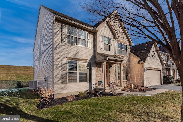 view of front of home with a garage, central air condition unit, and a front lawn