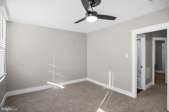 unfurnished room with carpet and ceiling fan