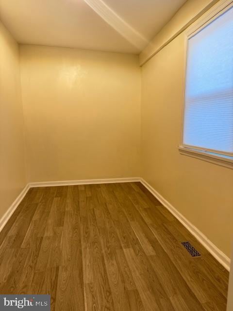 empty room with hardwood / wood-style floors