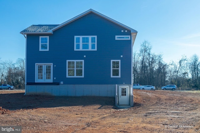 view of property exterior with french doors