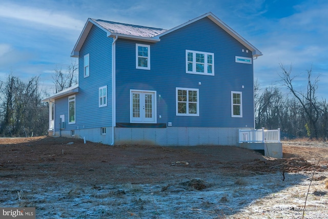 view of side of property with a wooden deck