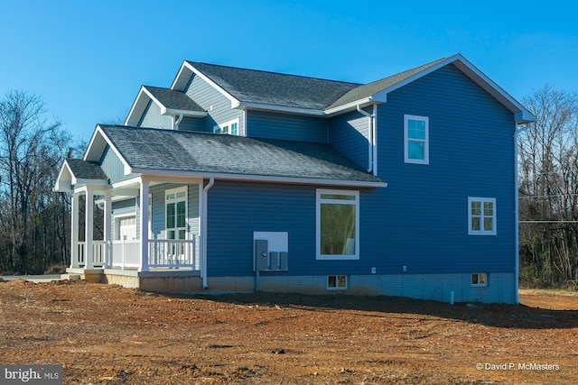 view of property exterior featuring a porch