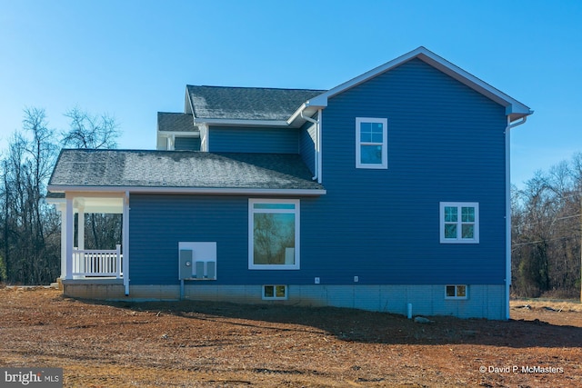 rear view of house with a porch