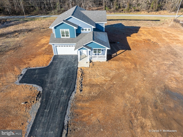 view of front of property with a garage and covered porch