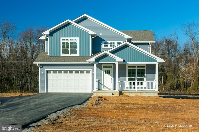 view of front of home featuring a garage and covered porch