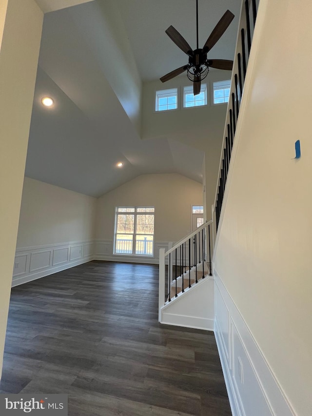 interior space featuring ceiling fan, high vaulted ceiling, and hardwood / wood-style floors