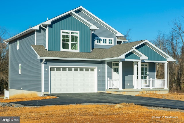 view of front of home featuring a garage and covered porch